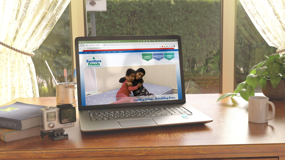A laptop on the Furniture Friends website
