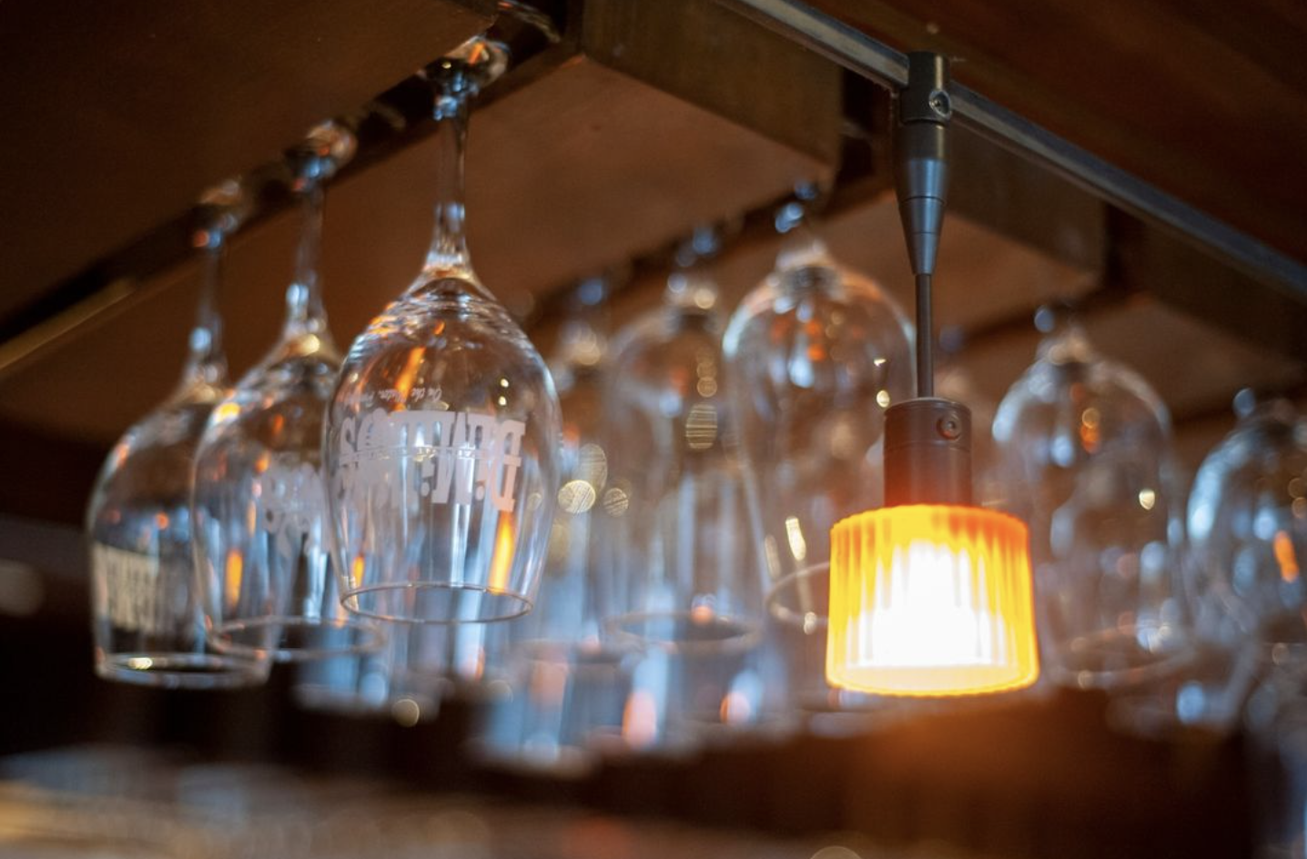 wine glasses hanging at the DiMillo's bar